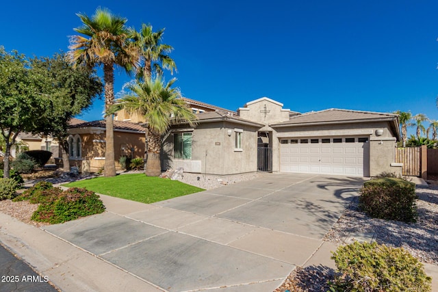 view of front facade featuring concrete driveway, a tile roof, an attached garage, a front lawn, and stucco siding