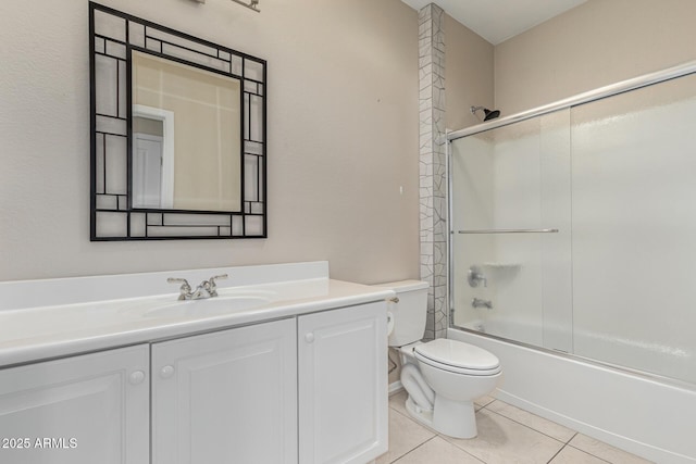 full bath with toilet, tile patterned flooring, combined bath / shower with glass door, and vanity