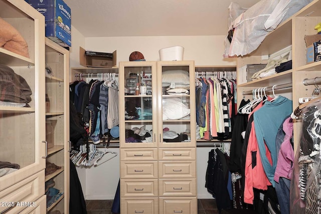 walk in closet with tile patterned floors