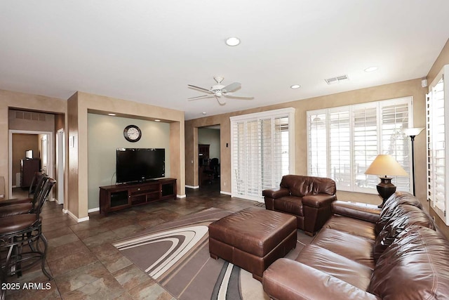 living area with recessed lighting, visible vents, baseboards, and ceiling fan