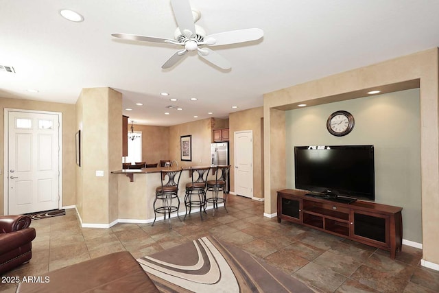 living room featuring visible vents, recessed lighting, baseboards, and ceiling fan