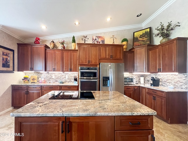 kitchen featuring light stone counters, tasteful backsplash, a kitchen island, appliances with stainless steel finishes, and crown molding