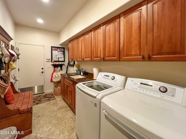 clothes washing area with recessed lighting, a sink, cabinet space, and separate washer and dryer