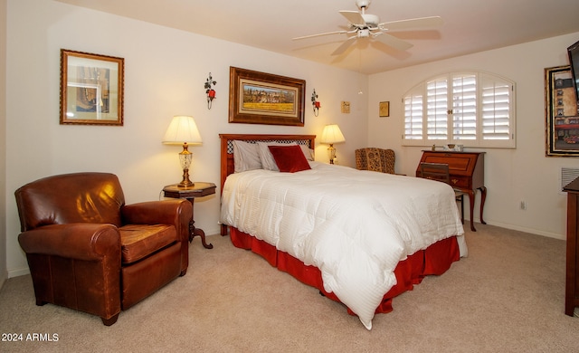 bedroom featuring baseboards, ceiling fan, and carpet flooring