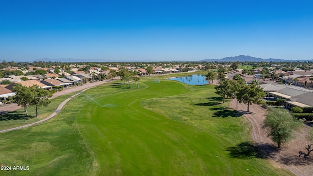 birds eye view of property featuring golf course view, a residential view, and a water and mountain view