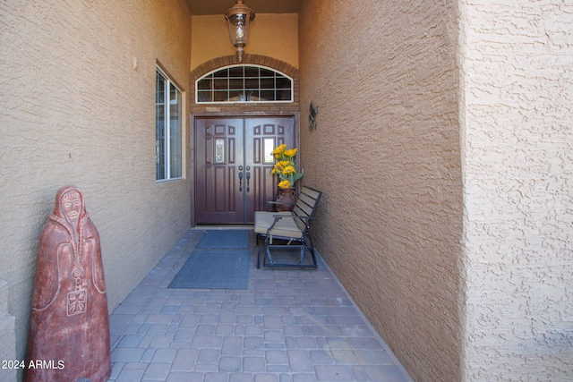 doorway to property with stucco siding