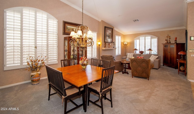 dining space with visible vents, crown molding, carpet flooring, a chandelier, and vaulted ceiling