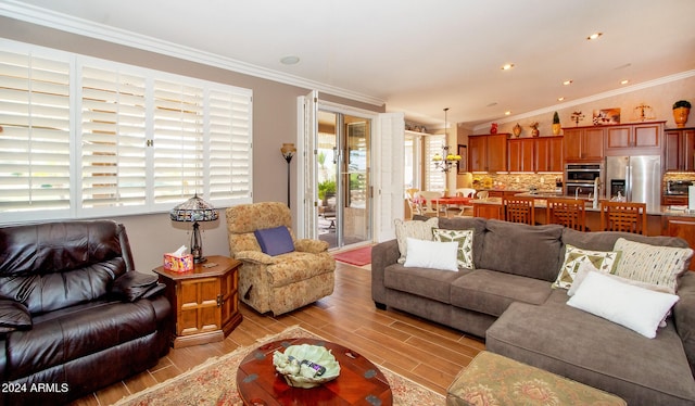 living room featuring wood finish floors, recessed lighting, and crown molding