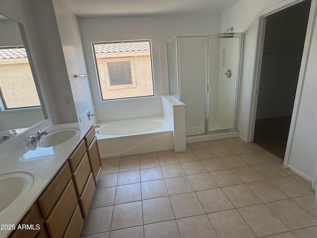 6416 N 78th Ln, Glendale, AZ 85303 - full bathroom with a stall shower, a garden tub, tile patterned floors, and double vanity