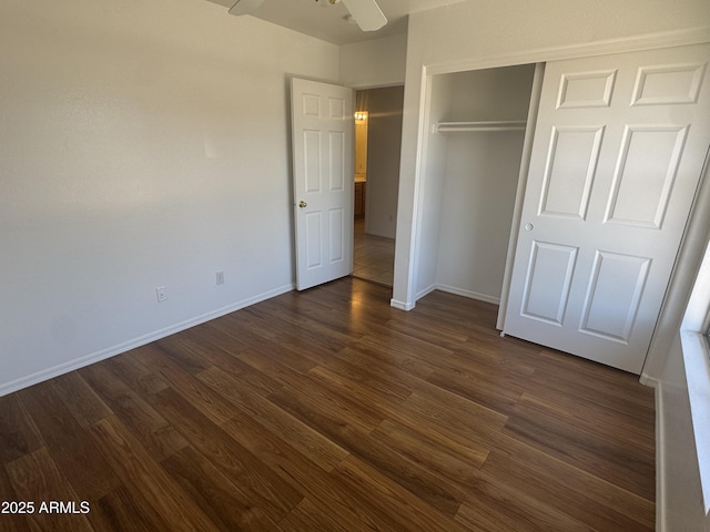 6416 N 78th Ln, Glendale, AZ 85303 - unfurnished bedroom with dark wood-type flooring, baseboards, a closet, and ceiling fan
