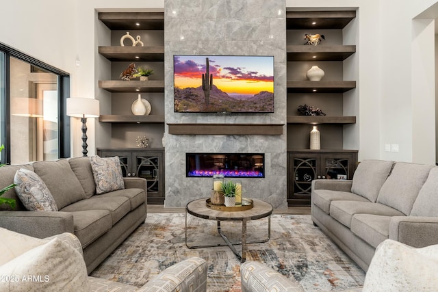 2656 E Oriole Dr, Gilbert, AZ 85297 - living room with built in features, a high end fireplace, and light hardwood / wood-style flooring