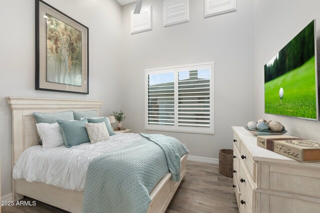 2656 E Oriole Dr, Gilbert, AZ 85297 - bedroom with light hardwood / wood-style floors and a high ceiling