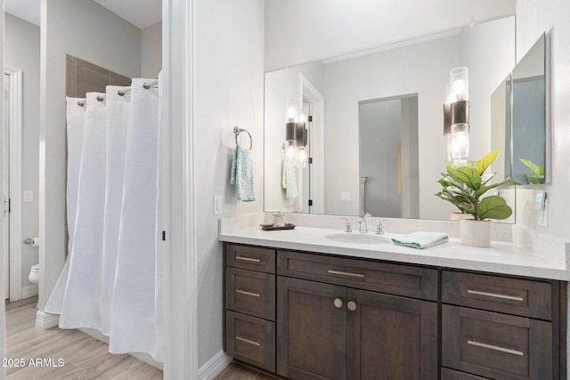 2656 E Oriole Dr, Gilbert, AZ 85297 - bathroom featuring toilet, vanity, and hardwood / wood-style floors
