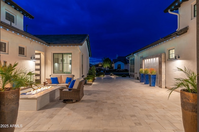 2656 E Oriole Dr, Gilbert, AZ 85297 - patio at twilight with an outdoor living space with a fire pit