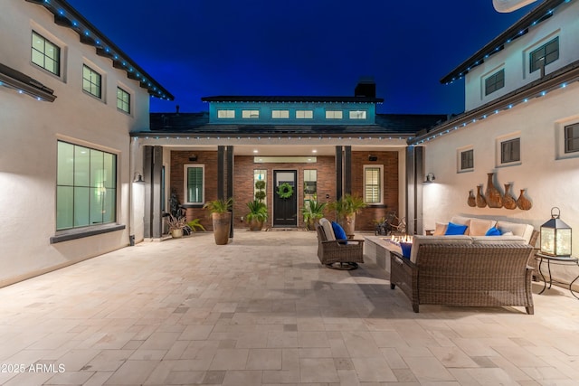 2656 E Oriole Dr, Gilbert, AZ 85297 - patio at night featuring an outdoor living space with a fire pit