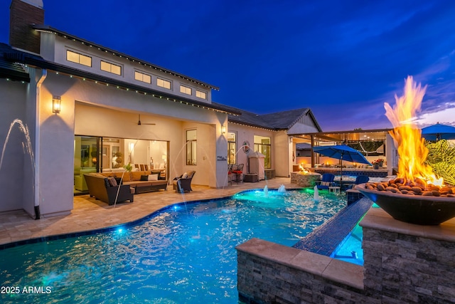 2656 E Oriole Dr, Gilbert, AZ 85297 - pool at dusk with ceiling fan, pool water feature, a patio area, and an outdoor living space with a fire pit