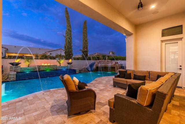 2656 E Oriole Dr, Gilbert, AZ 85297 - pool at dusk with an outdoor living space, pool water feature, and a patio area