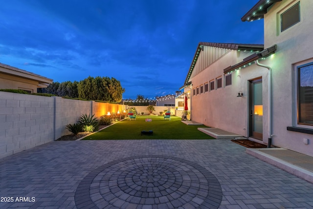 2656 E Oriole Dr, Gilbert, AZ 85297 - patio terrace at dusk featuring a yard
