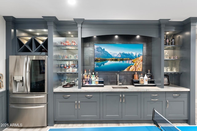 2656 E Oriole Dr, Gilbert, AZ 85297 - bar featuring gray cabinetry, sink, stainless steel fridge, and light stone countertops