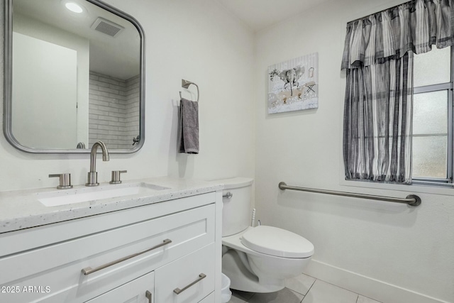 bathroom with visible vents, toilet, vanity, baseboards, and tile patterned floors