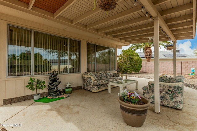 view of patio featuring fence