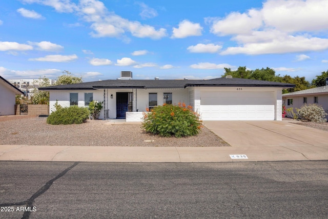 635 N 67th Pl, Mesa, AZ 85205 - ranch-style house with an attached garage and driveway
