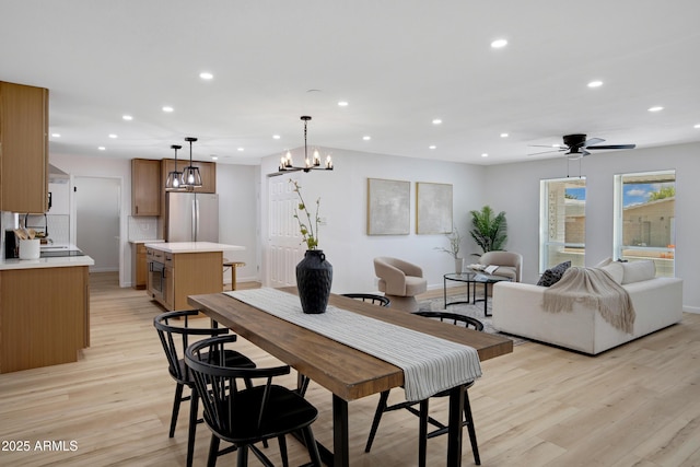 635 N 67th Pl, Mesa, AZ 85205 - dining area with light wood-style flooring, recessed lighting, ceiling fan, and a chandelier