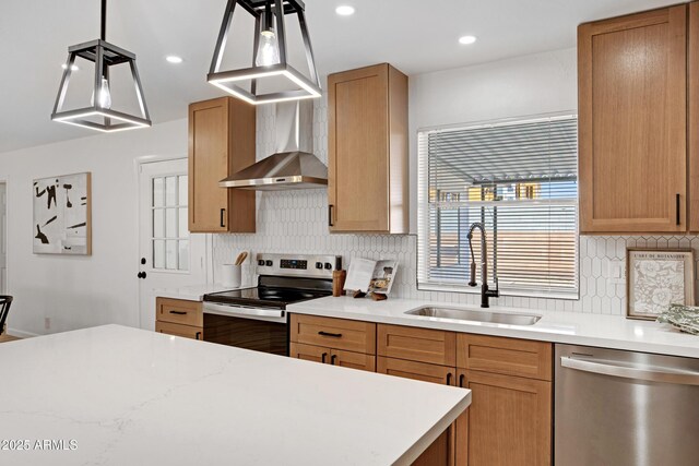 635 N 67th Pl, Mesa, AZ 85205 - kitchen with stainless steel appliances, a sink, wall chimney exhaust hood, tasteful backsplash, and recessed lighting