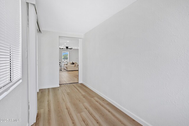 635 N 67th Pl, Mesa, AZ 85205 - hallway with light wood-style flooring and baseboards