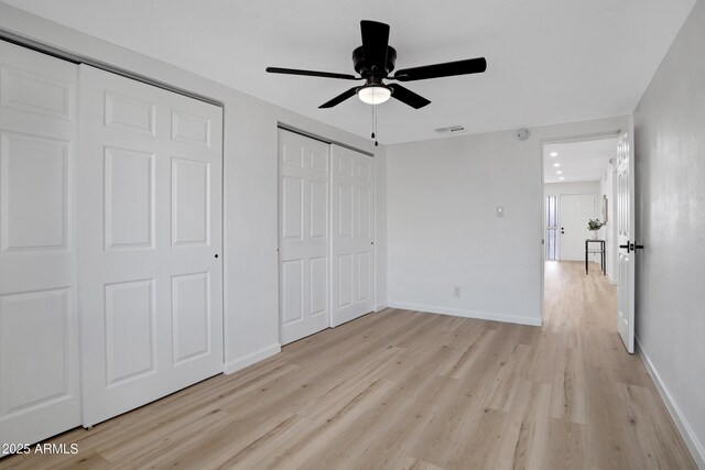 635 N 67th Pl, Mesa, AZ 85205 - unfurnished bedroom with light wood-style flooring, ceiling fan, and baseboards