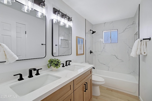 635 N 67th Pl, Mesa, AZ 85205 - bathroom with double vanity, toilet,  shower combination, and wood finished floors