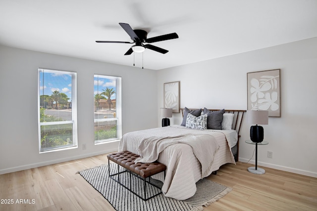 635 N 67th Pl, Mesa, AZ 85205 - bedroom featuring light wood-style flooring, baseboards, and a ceiling fan