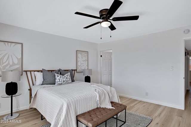 635 N 67th Pl, Mesa, AZ 85205 - bedroom with light wood-style flooring, baseboards, and a ceiling fan
