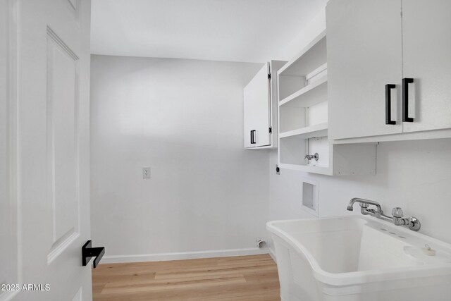 635 N 67th Pl, Mesa, AZ 85205 - washroom featuring cabinet space, hookup for a washing machine, electric dryer hookup, light wood-style flooring, and baseboards