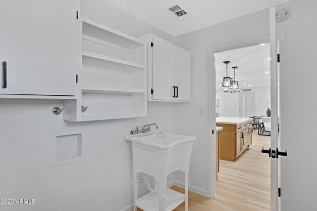 635 N 67th Pl, Mesa, AZ 85205 - washroom featuring light wood-type flooring and baseboards