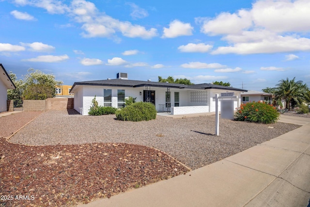 635 N 67th Pl, Mesa, AZ 85205 - ranch-style home with covered porch, an attached garage, and driveway