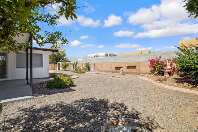 635 N 67th Pl, Mesa, AZ 85205 - fenced backyard with a patio area