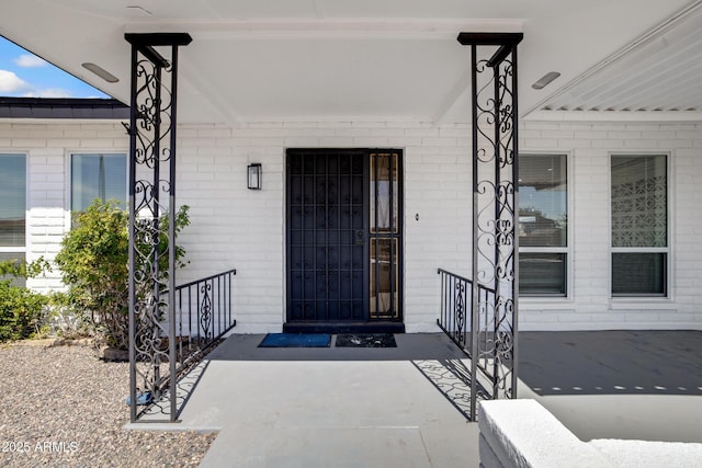 635 N 67th Pl, Mesa, AZ 85205 - view of exterior entry with covered porch and brick siding