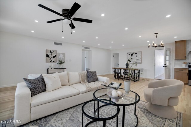 635 N 67th Pl, Mesa, AZ 85205 - living room with light wood-style floors, ceiling fan, a chandelier, recessed lighting, and baseboards