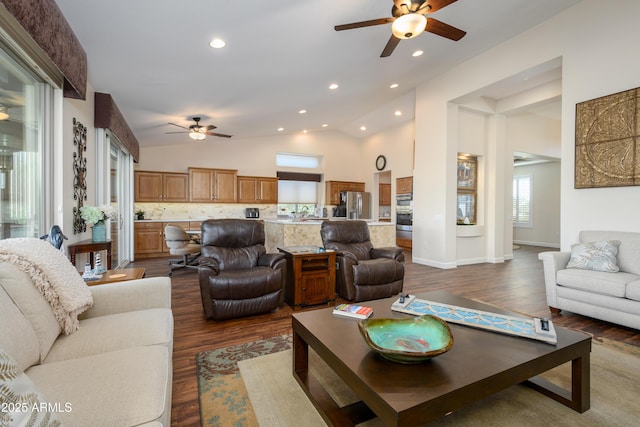 living room with vaulted ceiling, dark hardwood / wood-style floors, and ceiling fan