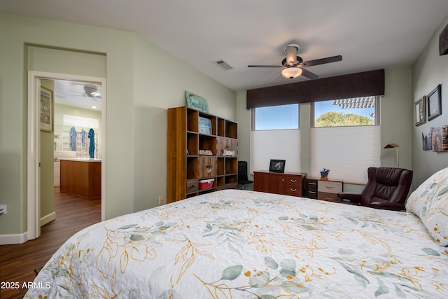 bedroom with ceiling fan and dark hardwood / wood-style floors