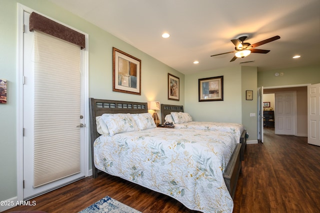 bedroom with ceiling fan and dark hardwood / wood-style floors