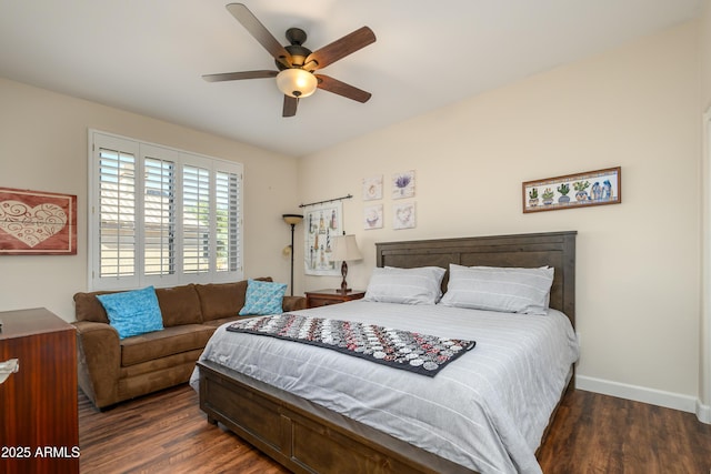 bedroom with ceiling fan and dark hardwood / wood-style flooring