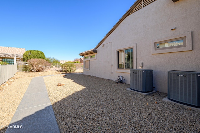 view of yard with central air condition unit