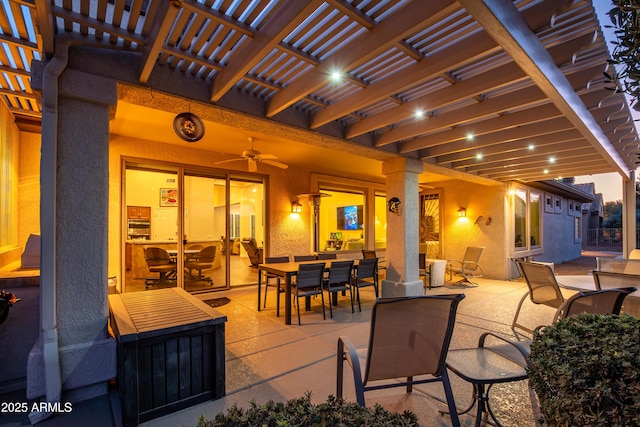 view of patio with ceiling fan and a pergola