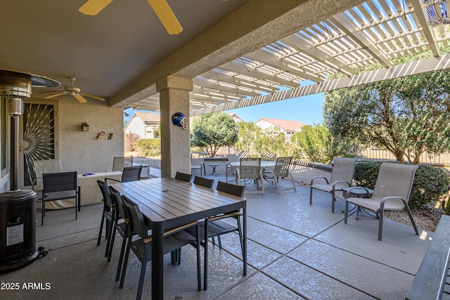 view of patio featuring ceiling fan and a pergola