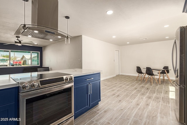 kitchen featuring blue cabinetry, island exhaust hood, stainless steel appliances, and light wood-style floors