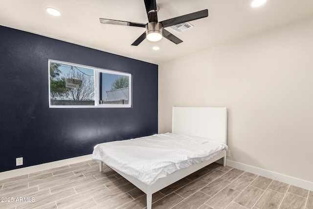 unfurnished bedroom featuring recessed lighting, baseboards, a ceiling fan, and wood finish floors