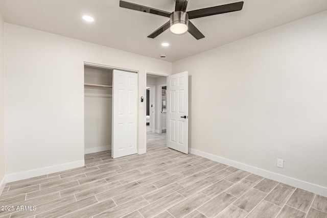 unfurnished bedroom featuring baseboards, a closet, recessed lighting, and wood tiled floor