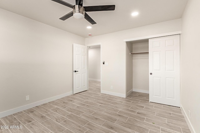 unfurnished bedroom with a ceiling fan, wood finish floors, baseboards, and recessed lighting